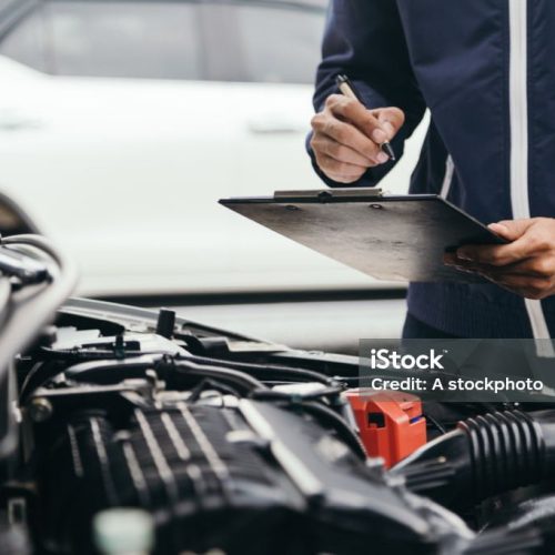 Automobile mechanic repairman hands repairing a car engine automotive workshop with a wrench, car service and maintenance,Repair service.